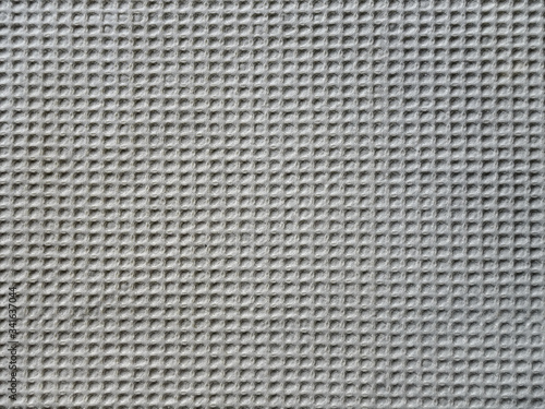 beige fabric material with strong texture, square pattern, close-up