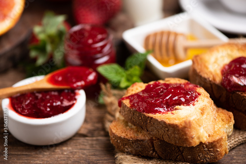 Fresh strawberry jam with bread for breakfast