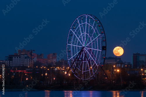 Full moon and ferris wheel