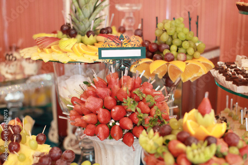 Candy bar on wedding ceremony with a lot of different candies and beverages