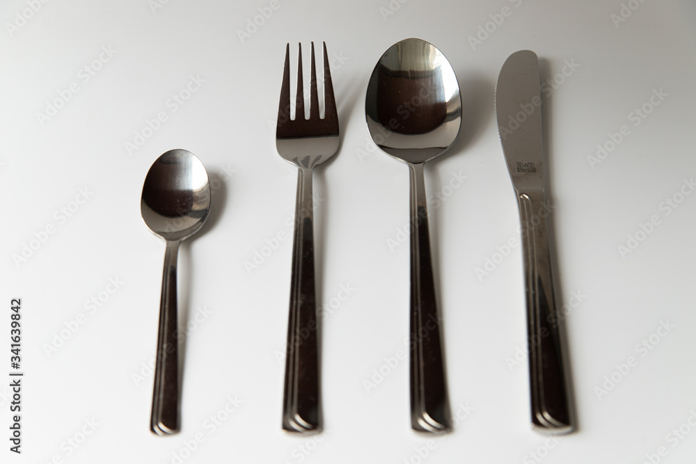 Silver fork spoon and knife on a white background Silver fork spoon and knife on a white background