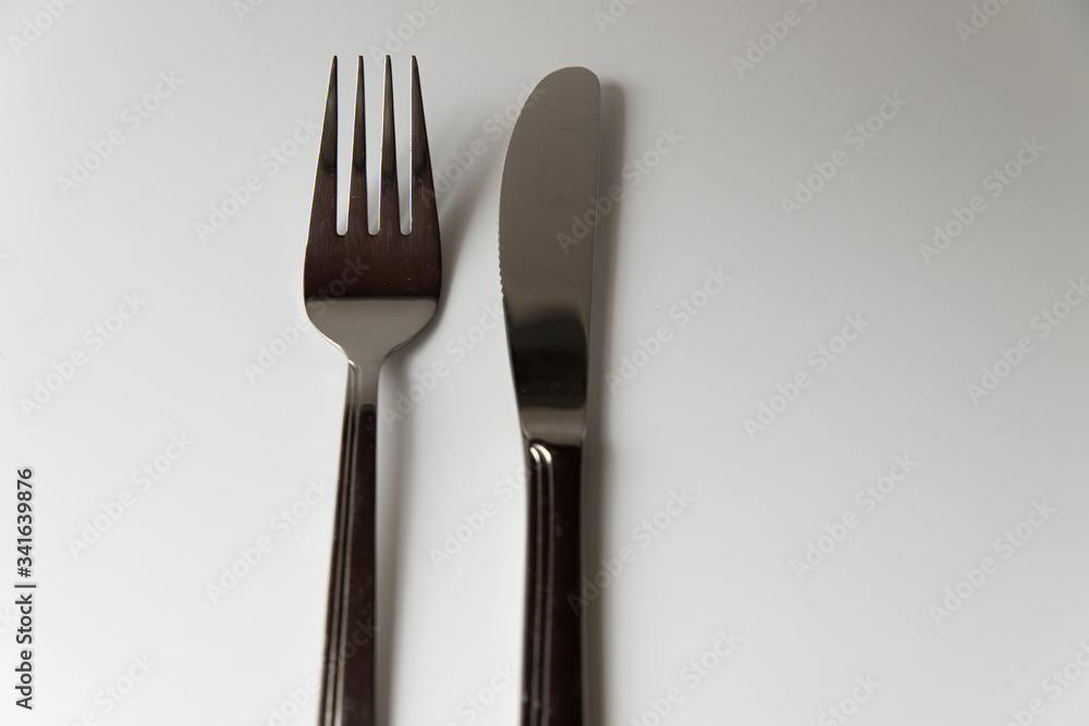 Silver fork and knife on a white background Silver fork and knife on a white background