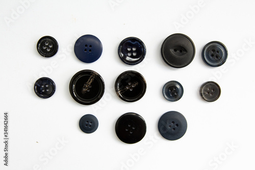 black buttons on a white background