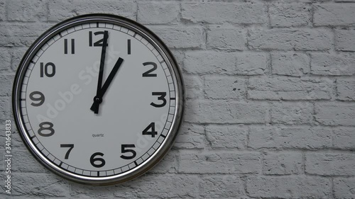 Wallpaper Mural The Time On The Clock One. Clock With The Black Arrows With The Arabic Numerals On An White Brick Wall Background On The Left Side. Torontodigital.ca