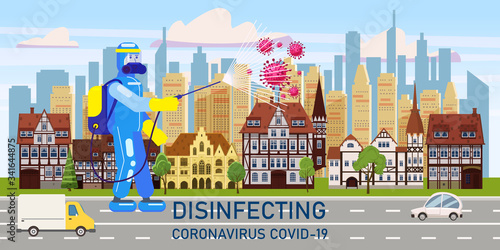 Man edical scientist in chemical protection suit disinfects spray to cleaning and disinfect virus Covid-19 in city downtown on street