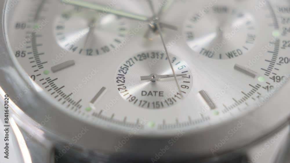 Counting time metallic wristwatch. Macro shot. Close up. Counting time metallic wristwatch. Macro shot. Close up.