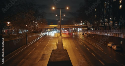 Wallpaper Mural Shot of a Street in cologne with wet road an nice reflections at night. Cars are passing in both directions. Torontodigital.ca