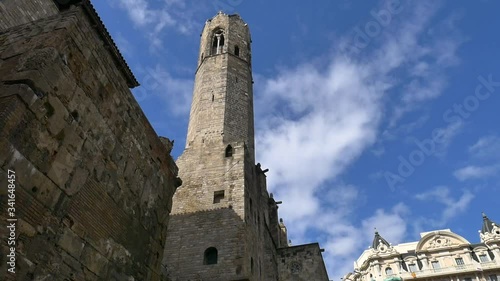 Ancient medieval tower part of Barcelona's city centre within famous gotic suburs during sunny day photo