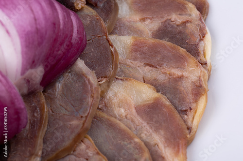 Meat plate with meat stock with red onions photo