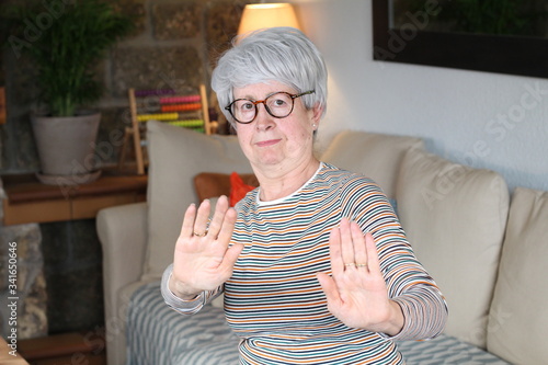Canvas Print Senior woman rejecting with hand gesture