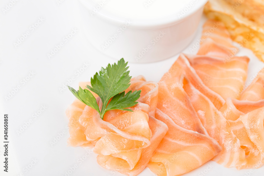 Fragment of breakfast with salmon and pancake. Fragment of breakfast with salmon and pancake.