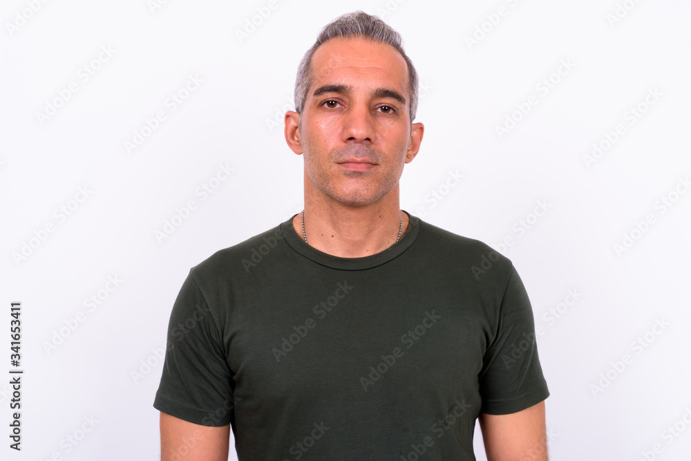 Portrait of handsome Persian man looking at camera Portrait of handsome Persian man looking at camera