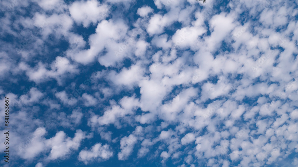 Scattered white clouds in the blue sky. Scattered white clouds in the blue sky.