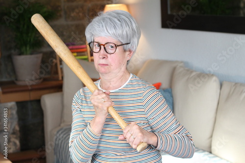 Sticker Senior woman holding baseball bat