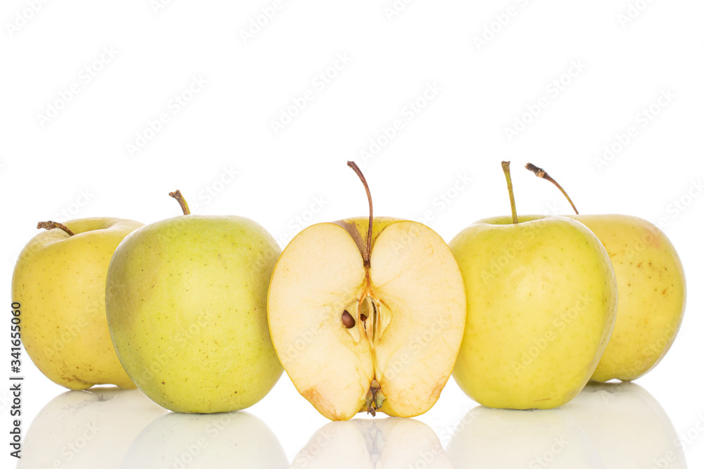 Group of four whole one half of green delicious apple isolated on white Group of four whole one half of green delicious apple isolated on white