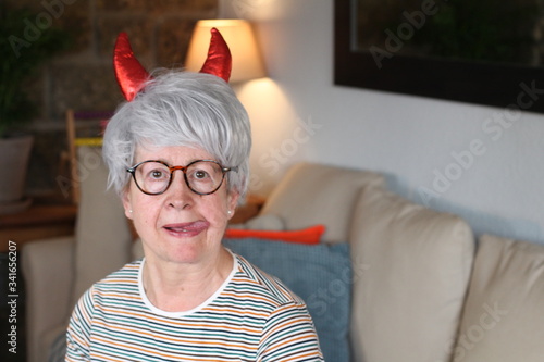 Senior woman with demon horns