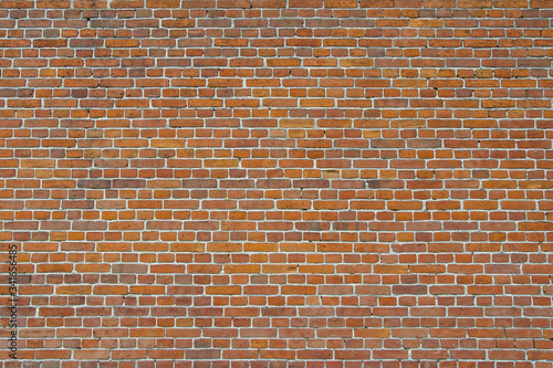 Brick wall of red brick in an old house.