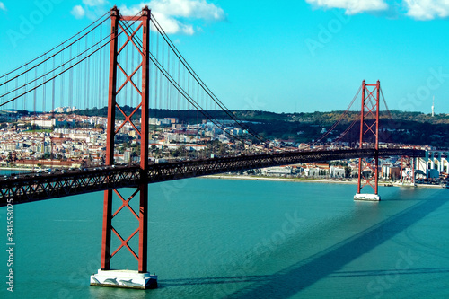 25th of April Bridge over the Tagus river, connecting Almada and Lisbon in Portugal photo