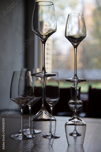 The row of wine glasses on a sill.