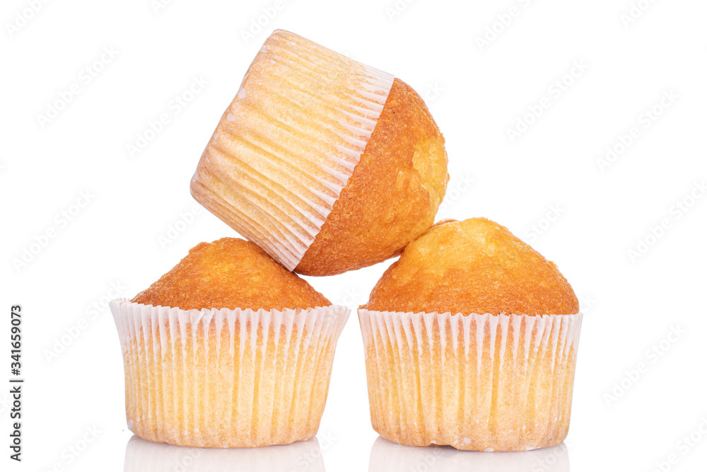 Group of three whole small baked muffin isolated on white Group of three whole small baked muffin isolated on white