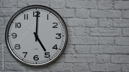 Wallpaper Mural The Time On The Clock Five. Clock With The Black Arrows With The Arabic Numerals On An White Brick Wall Background On The Left Side. Torontodigital.ca