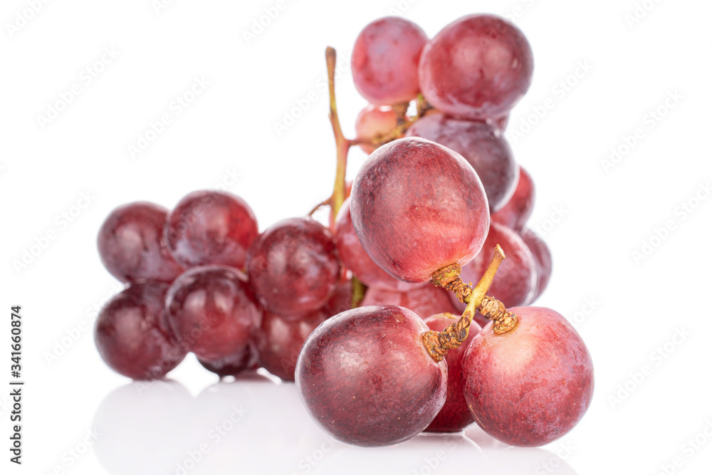 Lot of whole fresh red globe grape isolated on white