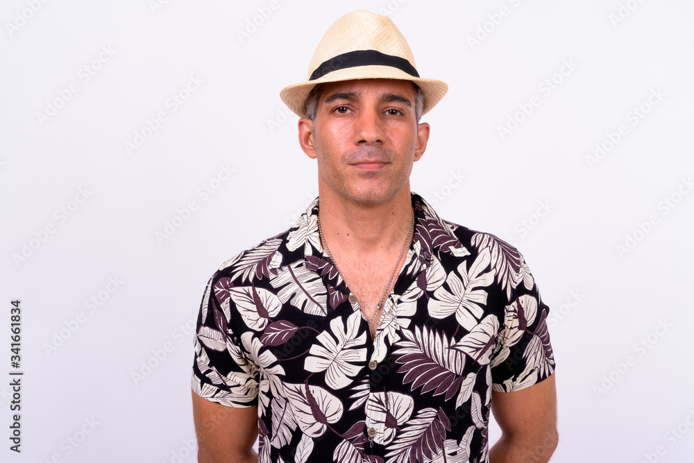 Handsome Persian tourist man against white background