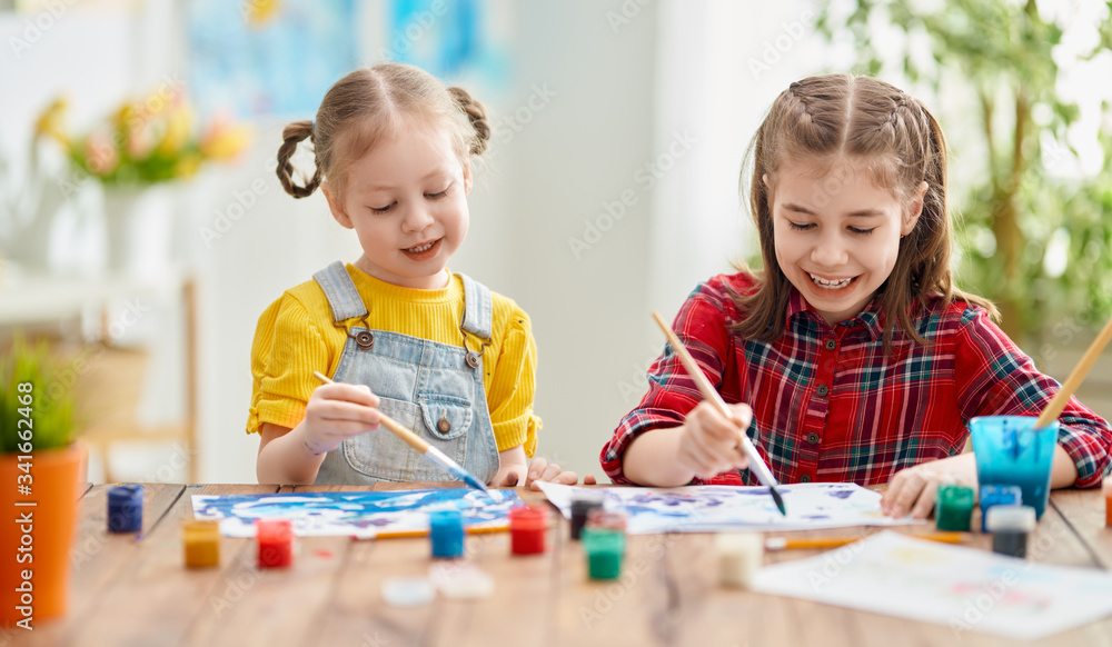 Happy kids are painting at home. Happy kids are painting at home.