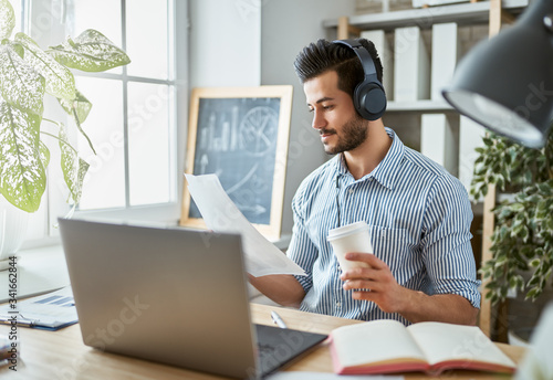 man working on a laptop at home.