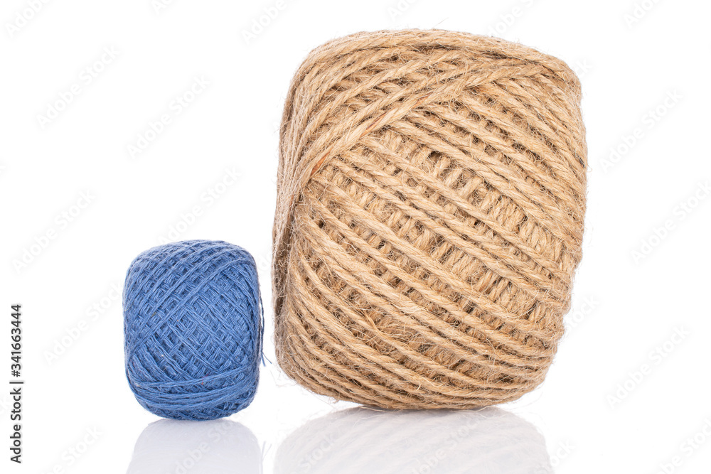 Group of two whole blue and beige thread spools isolated on white Group of two whole blue and beige thread spools isolated on white