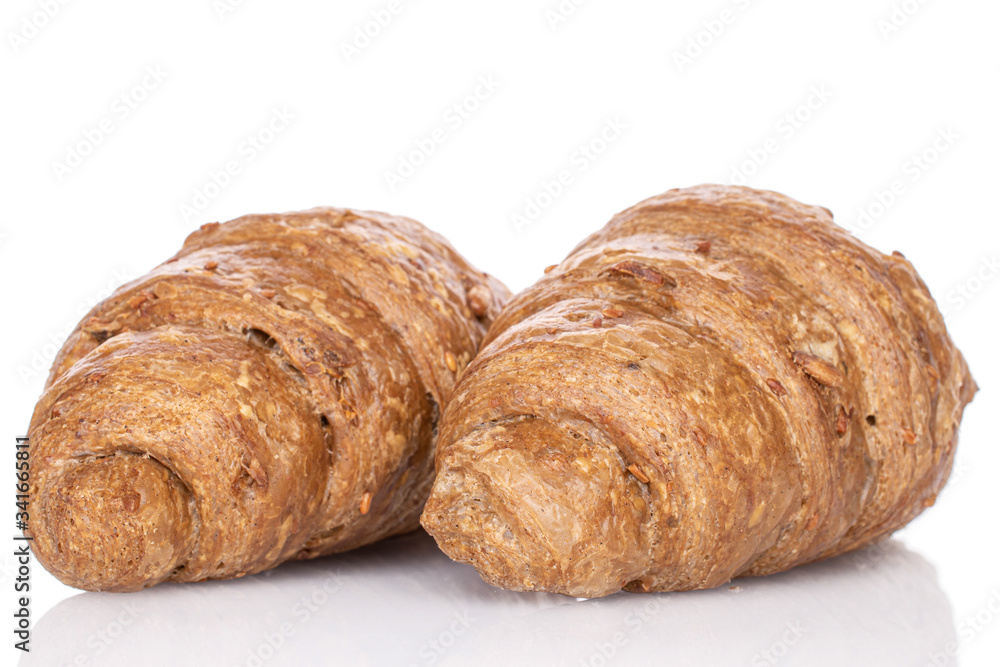 Group of two whole baked wholegrain croissant isolated on white Group of two whole baked wholegrain croissant isolated on white