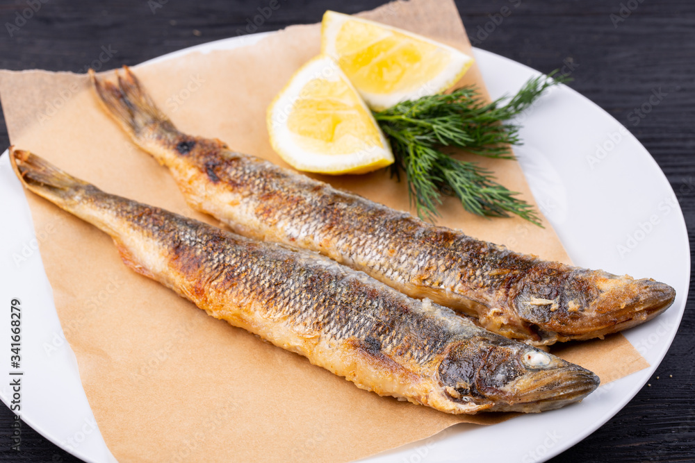 Mackerel grilled, served with lemon and dill Mackerel grilled, served with lemon and dill