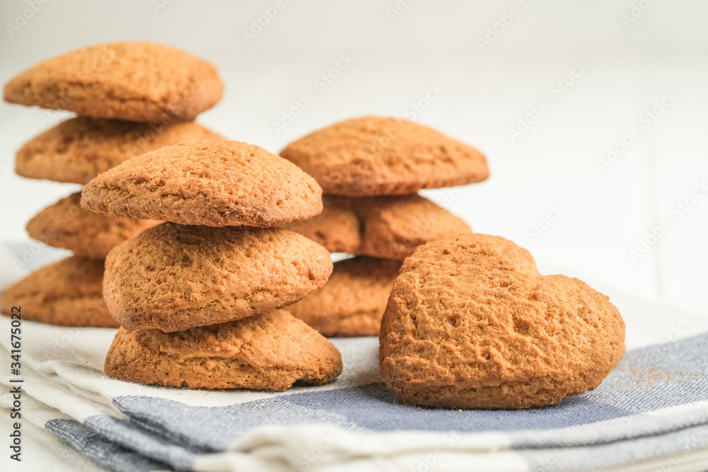 .Ginger cookie on a light napkin on a light background top view copy space. .Ginger cookie on a light napkin on a light background top view copy space.