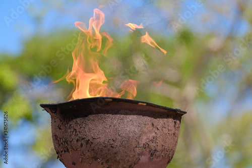 memorial fire in a soldiers helmet