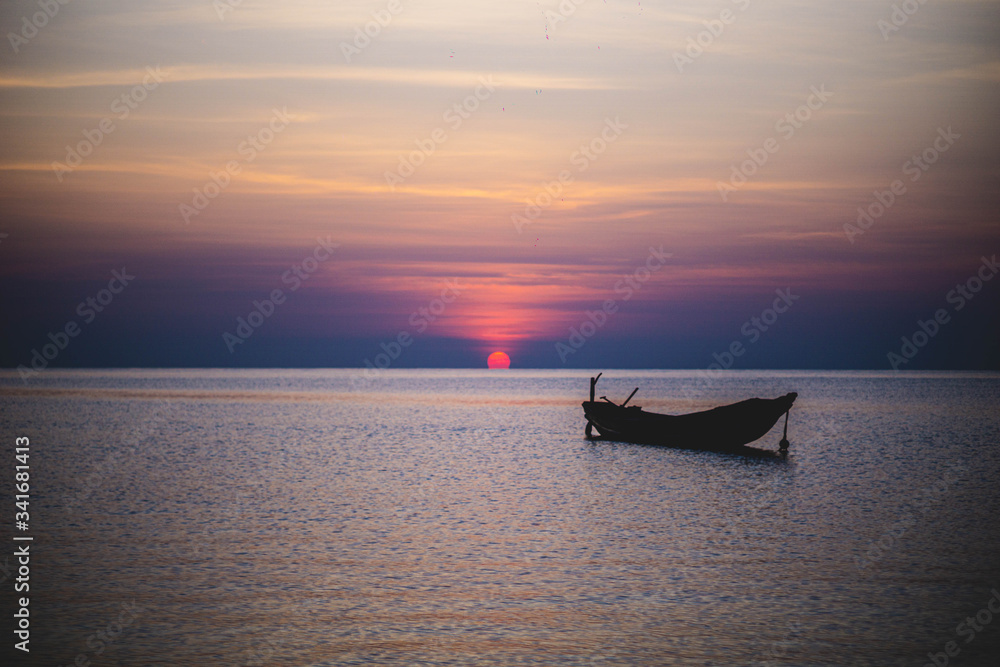boat on the beach during sunrise in havelock andaman india
