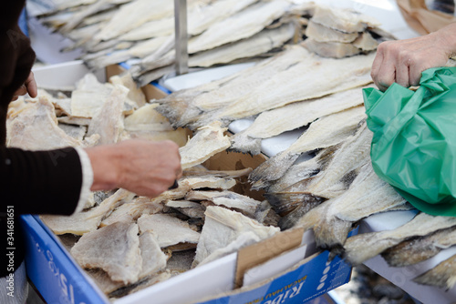 Fish market stall with salted codfish, traditional bacalhau