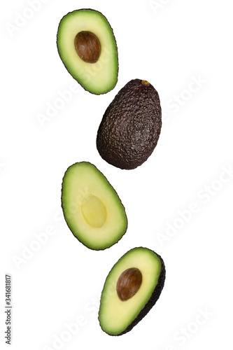 Falling brown avocado isolated on white background with clipping path as package design element and advertising. Floating fruits in the air. Flying food.