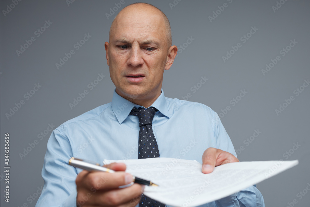 The clerk gives the documents for signature. The clerk gives the documents for signature.