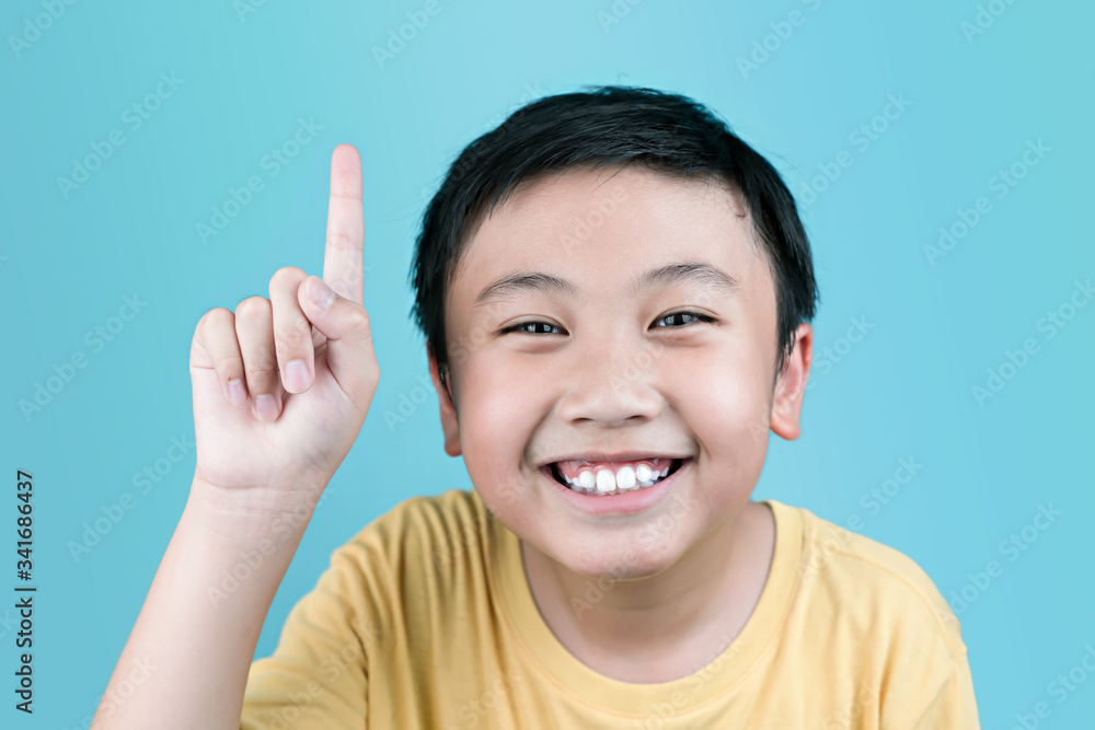 Portrait boy smile and show finger up. Portrait boy smile and show finger up.