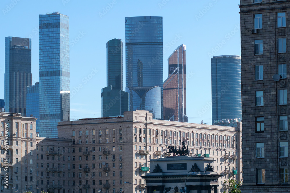 Old soviet residential houses, skyscrapers of Moscow city and triumphal arch. Moscow, Russia. Old soviet residential houses, skyscrapers of Moscow city and triumphal arch. Moscow, Russia.