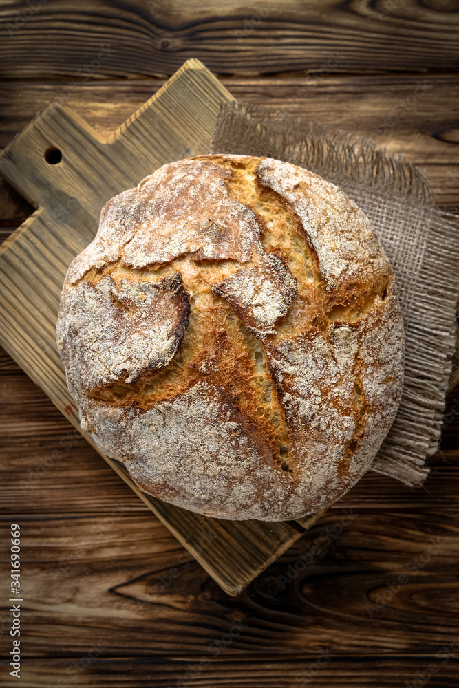 Delicious homemade bread on a napkin on rustic background. Delicious homemade bread on a napkin on rustic background.