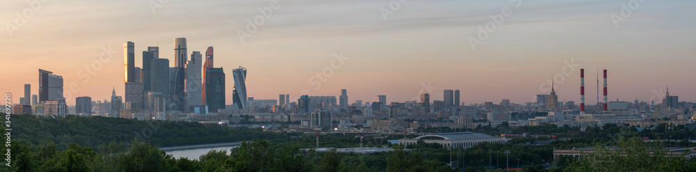 Sunset panorama of skyscrapers of Moscow city from Vorobyovy Gory viewpoint. Moscow, Russia.