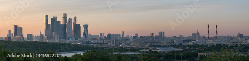 Sunset panorama of skyscrapers of Moscow city from Vorobyovy Gory viewpoint. Moscow, Russia.