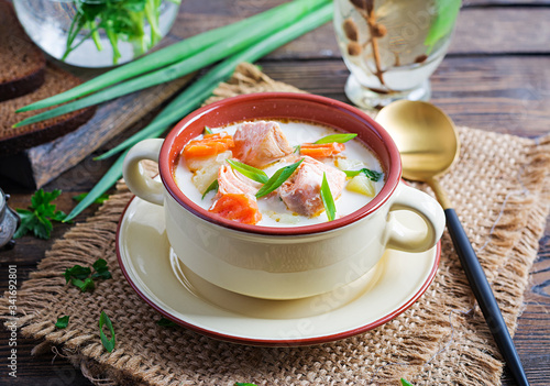 Kalakeitto. Creamy soup with salmon, potatoes, onions and carrots and  in a bowl. Finnish/ karelian cuisine. Lohikeitto photo