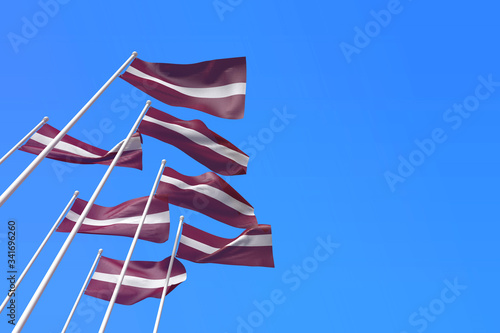 Latvia flags waving in the wind against a blue sky. 3D Rendering