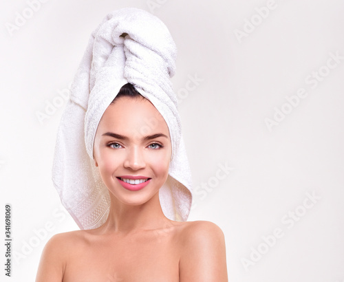 Beautiful young woman perfect skin. Healthy woman in towel with perfect skin