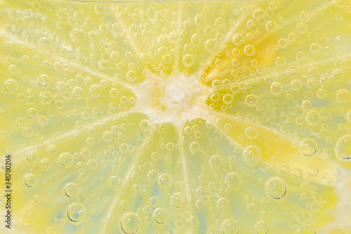 lemon fruits in water under water with bubbles. juicy citrus close-up, macro. selective focus.