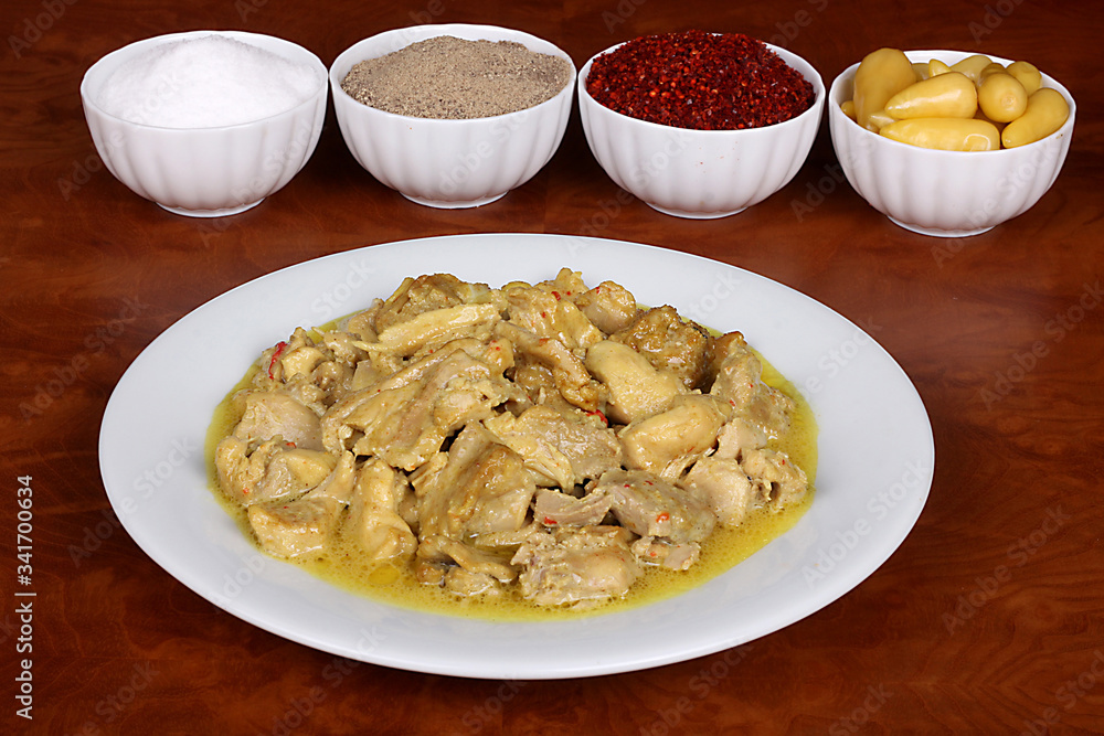 chicken with a very nice curry sauce with fragrant Turkish spices on a white plate chicken with a very nice curry sauce with fragrant Turkish spices on a white plate