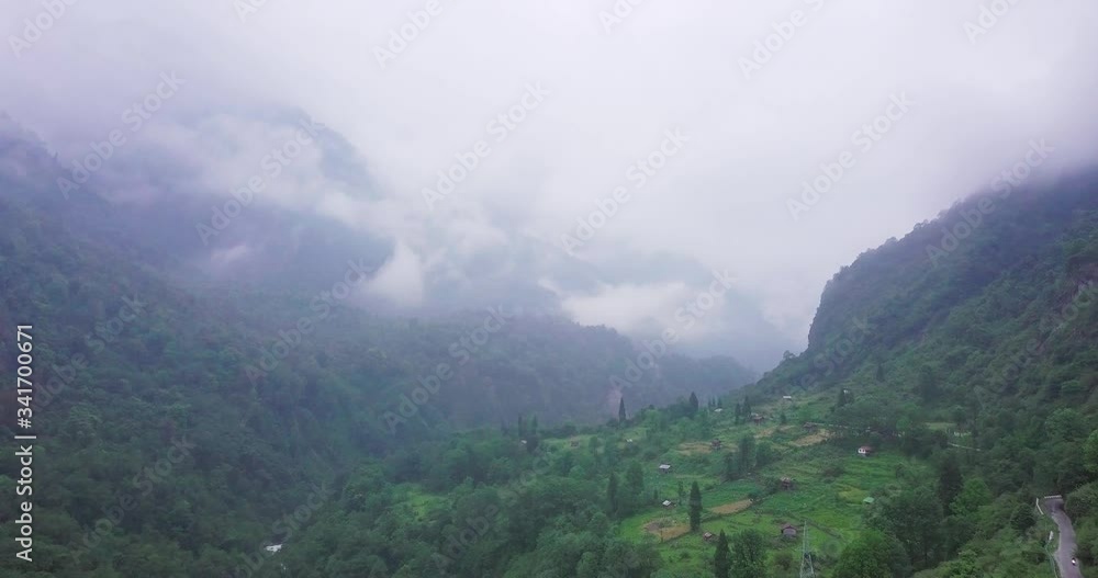 Aerial shot of fog covered mountainious landscape of Sikkim, India. Aerial shot of fog covered mountainious landscape of Sikkim, India.