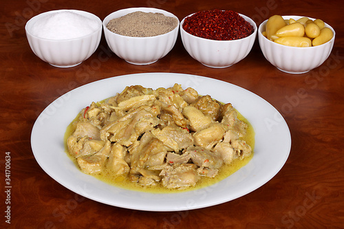 chicken with a very nice curry sauce with fragrant Turkish spices on a white plate